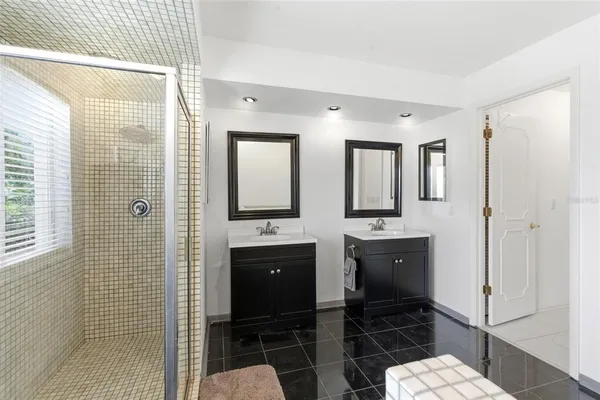 a bathroom with a bathtub and shower