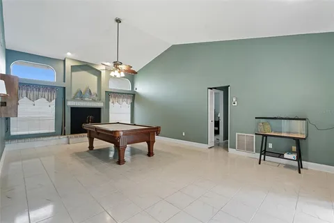 a large kitchen with stainless steel appliances wooden cabinets and a granite counter tops