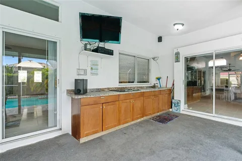 a view of a lake with a table and chairs