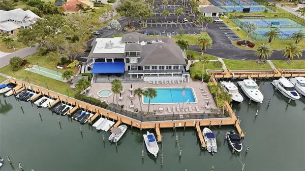 an aerial view of a residential building with outdoor space lake view and mountain view