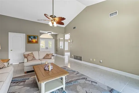 a kitchen with stainless steel appliances granite countertop a kitchen island hardwood floor sink stove dining table and chairs