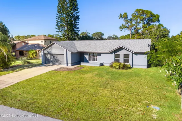 an aerial view of a house with swimming pool