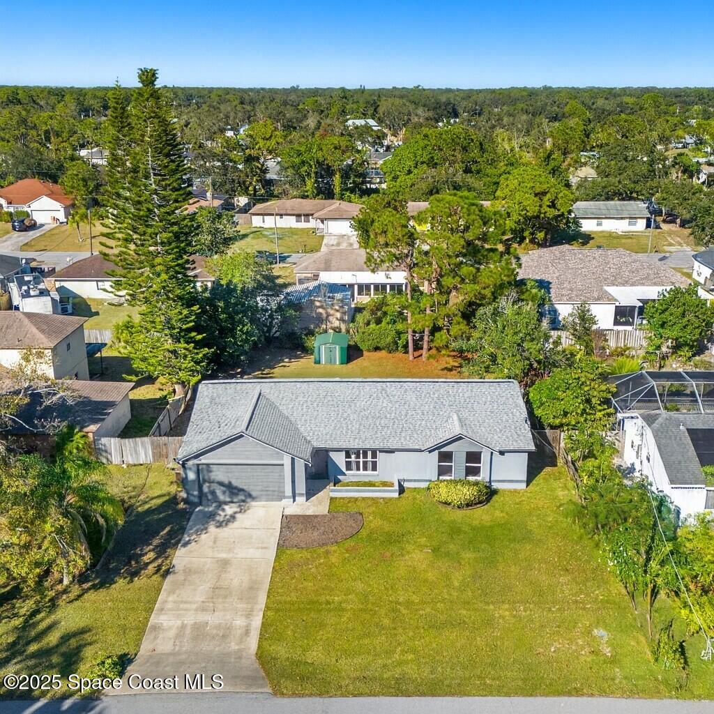 4852 Alfred Street Cocoa, FL 32927 - Photo 3 of 59 an aerial view of a house with swimming pool
