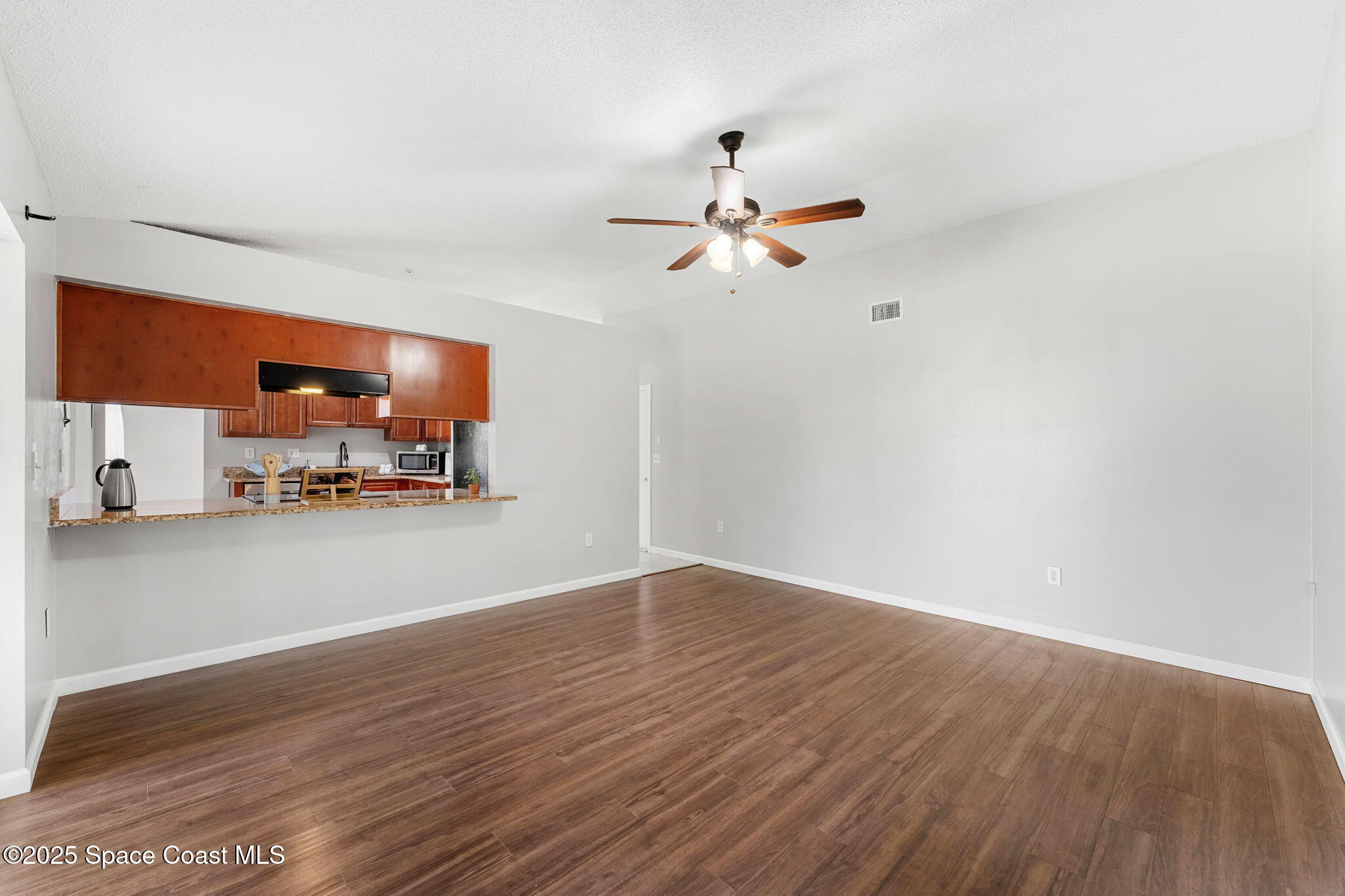 4852 Alfred Street Cocoa, FL 32927 - Photo 33 of 59 a view of a livingroom with a flat screen tv and fireplace