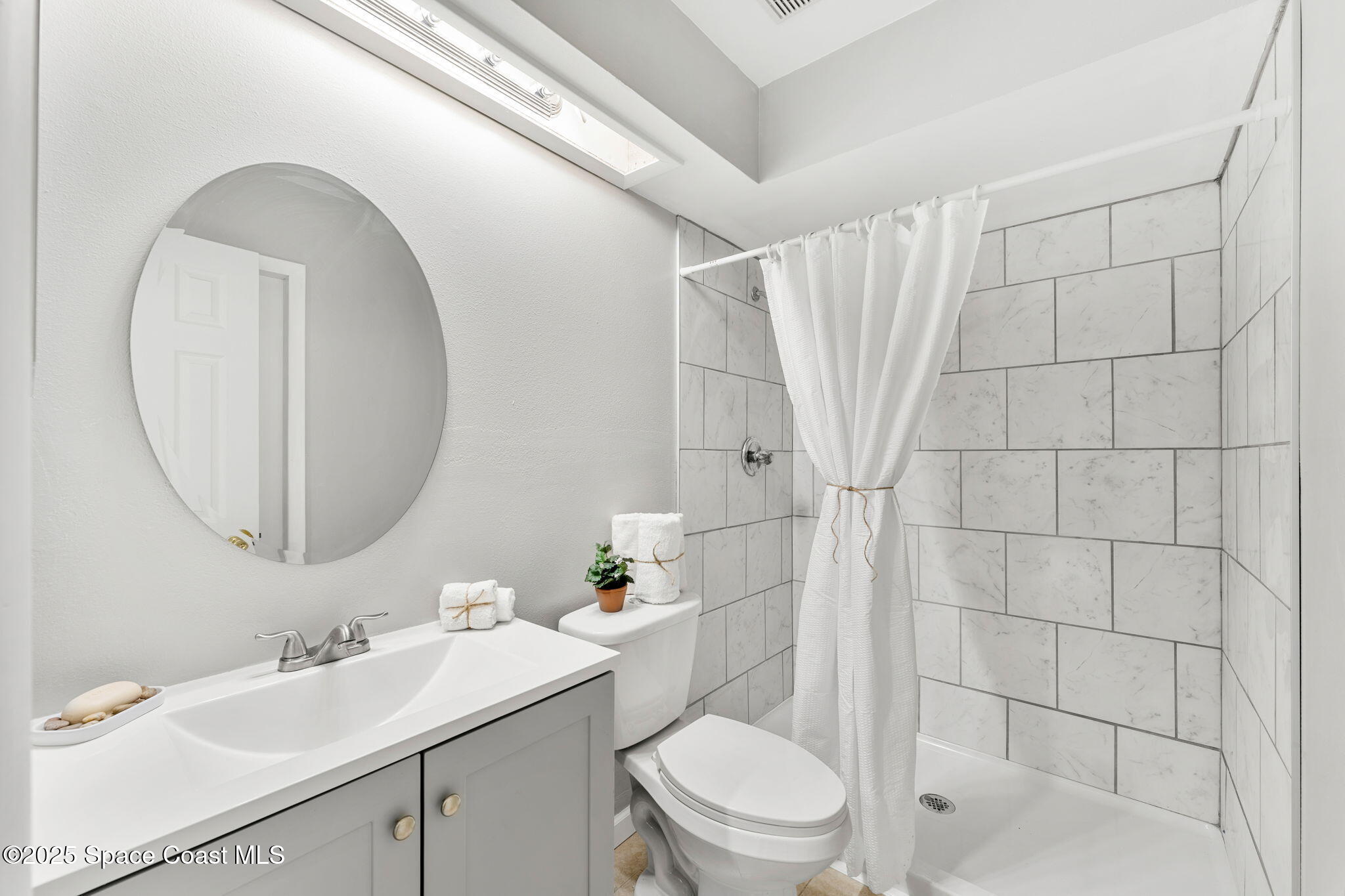 4852 Alfred Street Cocoa, FL 32927 - Photo 39 of 59 a bathroom with a sink toilet and shower