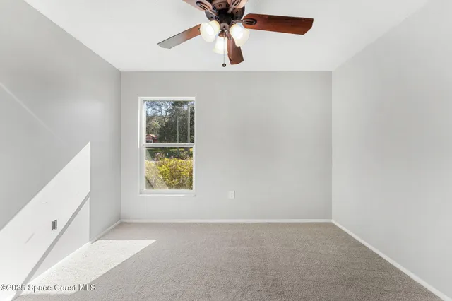 a view of a hardwood & staircase in a room