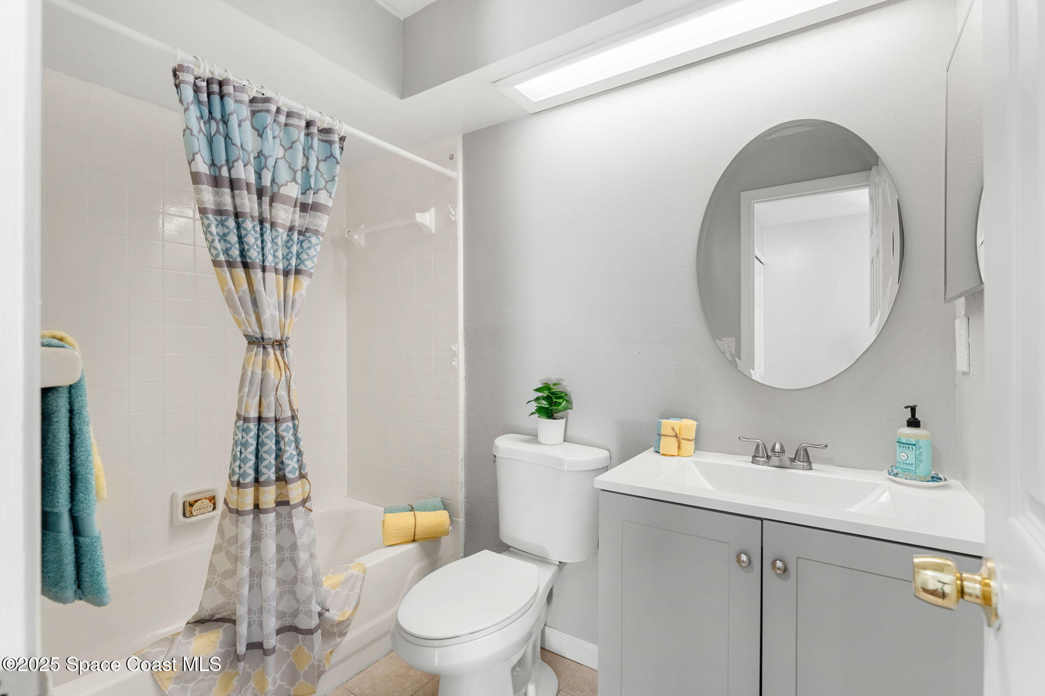 4852 Alfred Street Cocoa, FL 32927 - Photo 44 of 59 a bathroom with a sink a toilet and shower