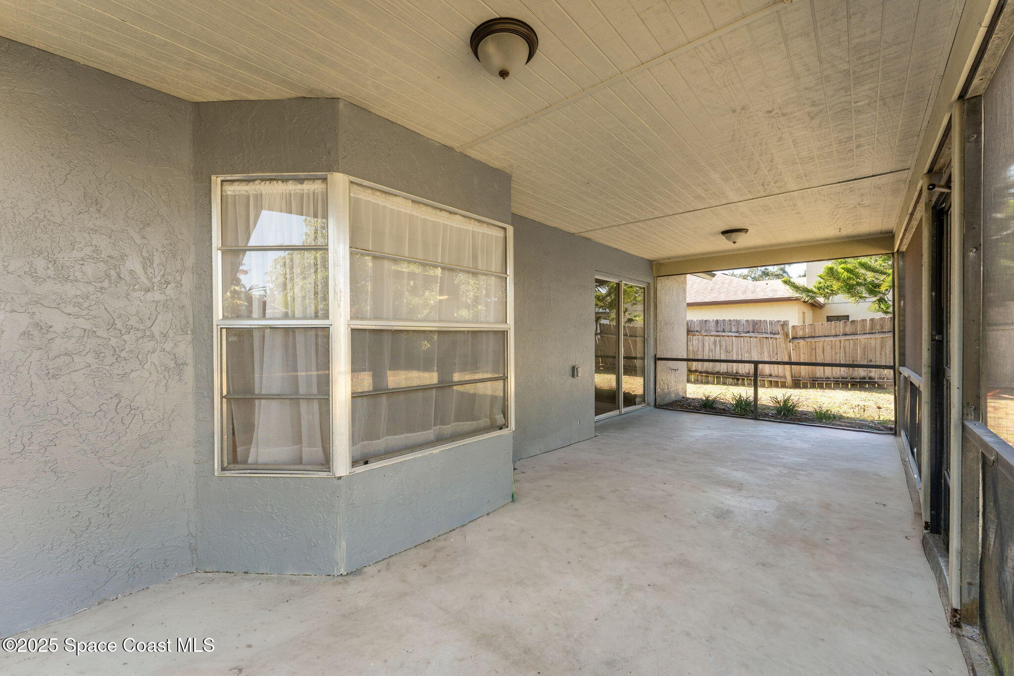 4852 Alfred Street Cocoa, FL 32927 - Photo 45 of 59 an empty room with windows