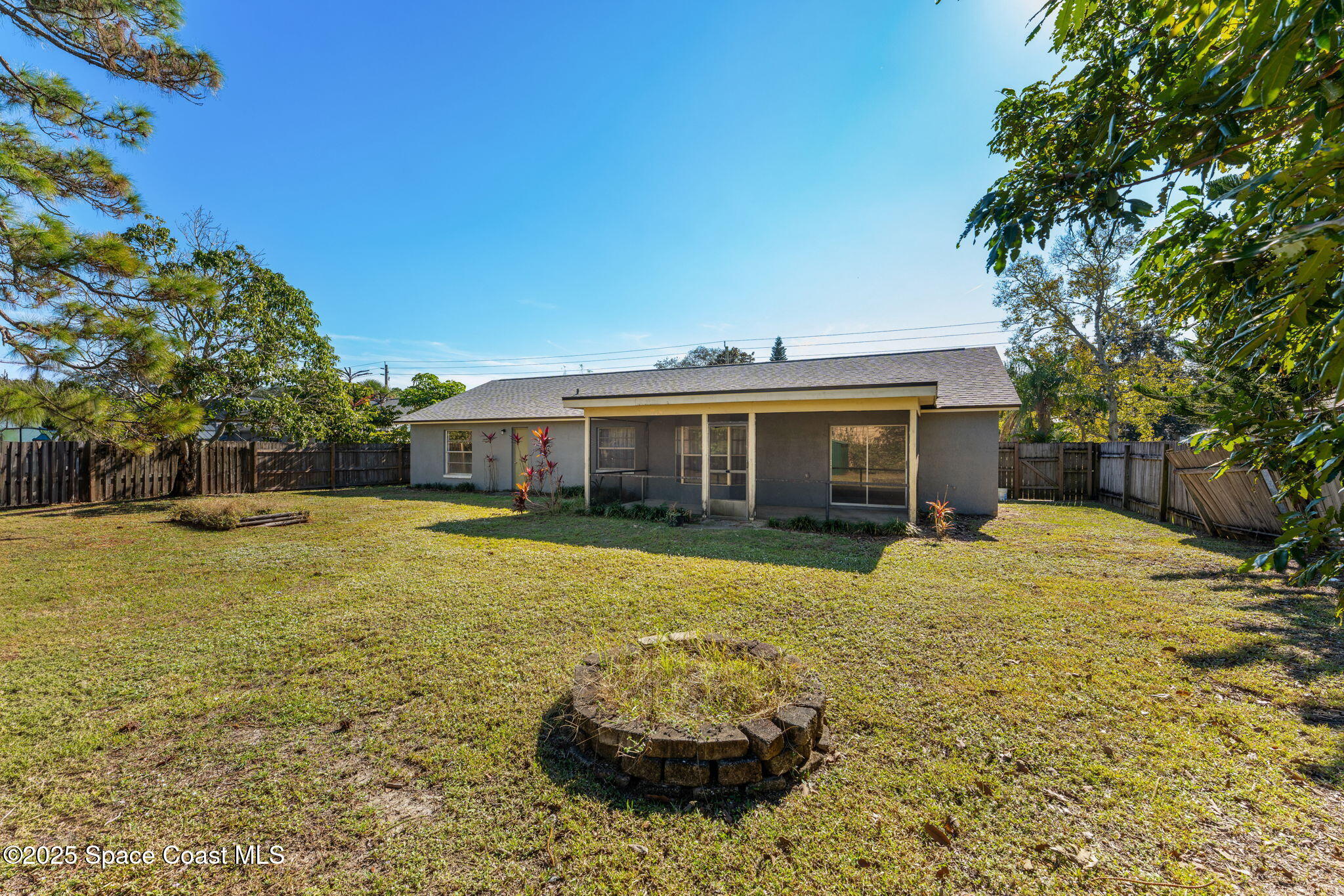 4852 Alfred Street Cocoa, FL 32927 - Photo 52 of 59 a front view of a house with a yard