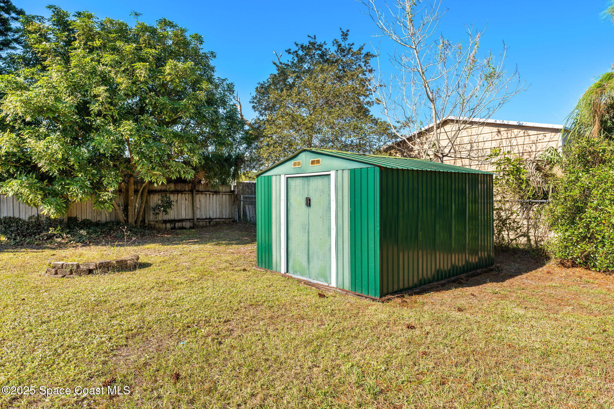 4852 Alfred Street Cocoa, FL 32927 - Photo 53 of 59 a view of a house with a yard