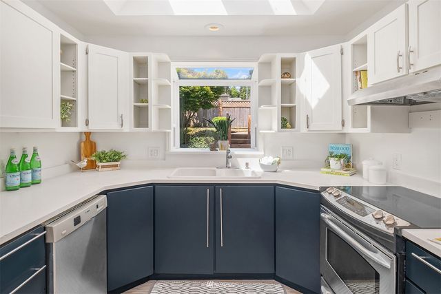 a kitchen with a sink and cabinets