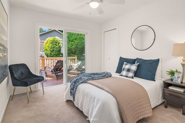 a bed room with a bed and a chair