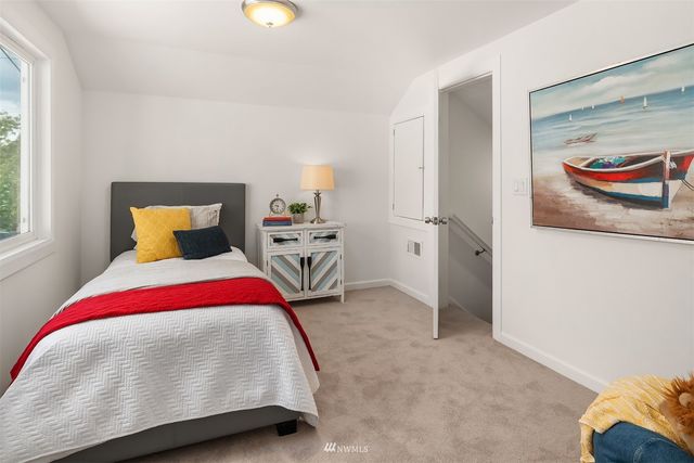 a bedroom with a bed and dresser