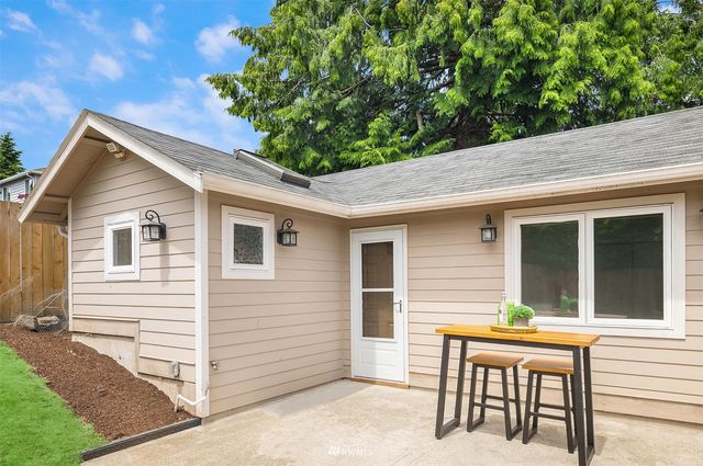a backyard of a house with seating space