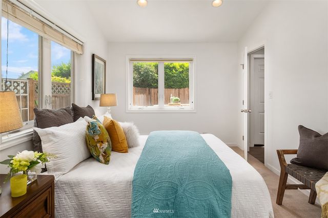 a bedroom with bed and a window