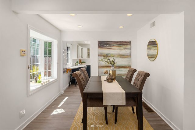 a view of a dining room with furniture and window