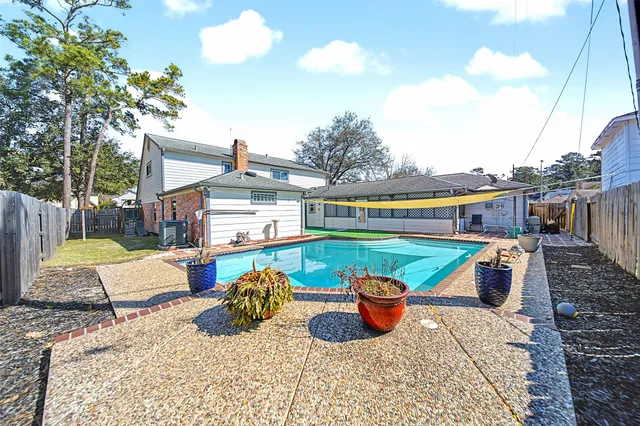 a view of a backyard with a patio