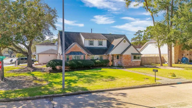 a view of a house with swimming pool and sitting area