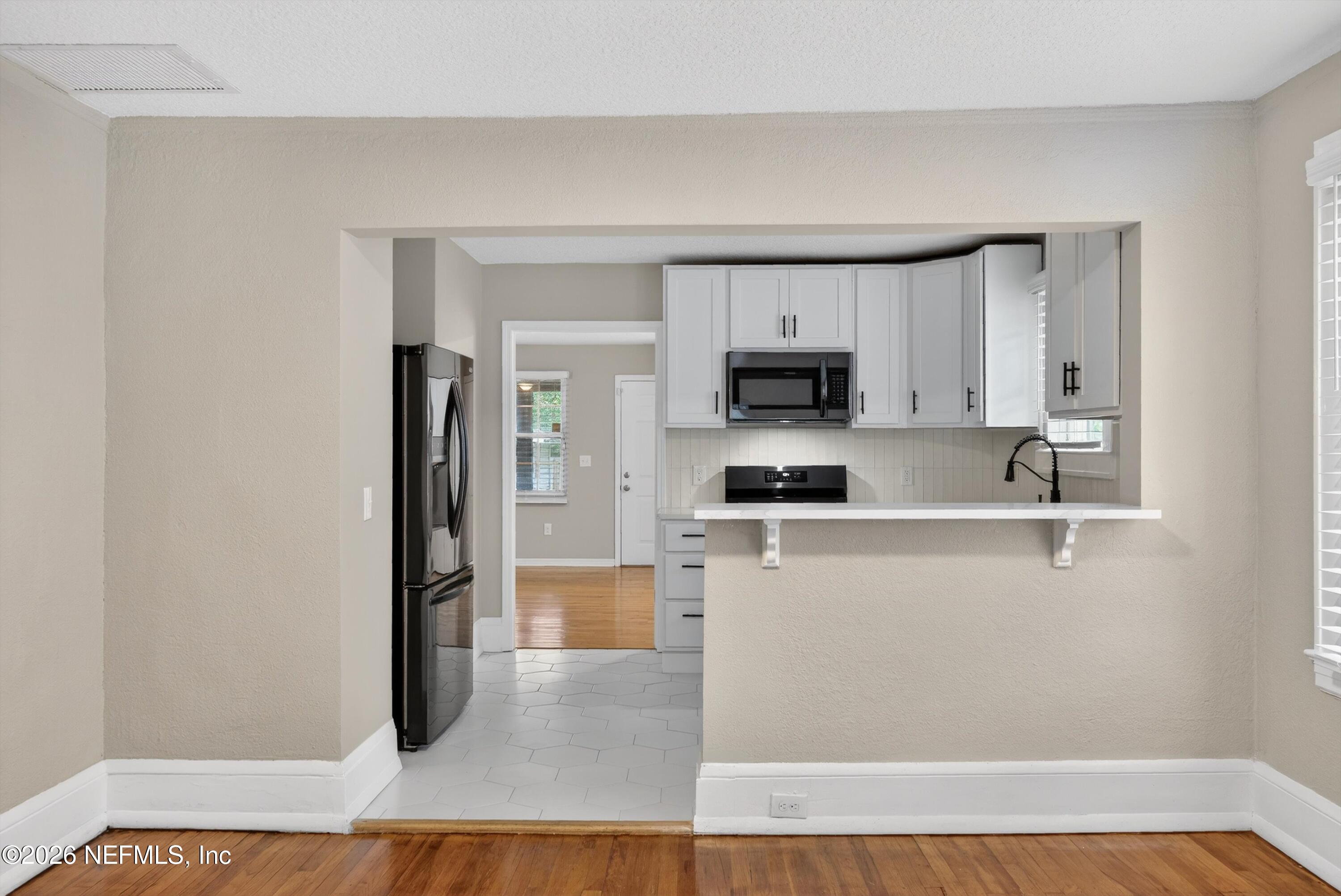4755 French Street Jacksonville, FL 32205 - Photo 12 of 42 DINING ROOM TO KITCHEN