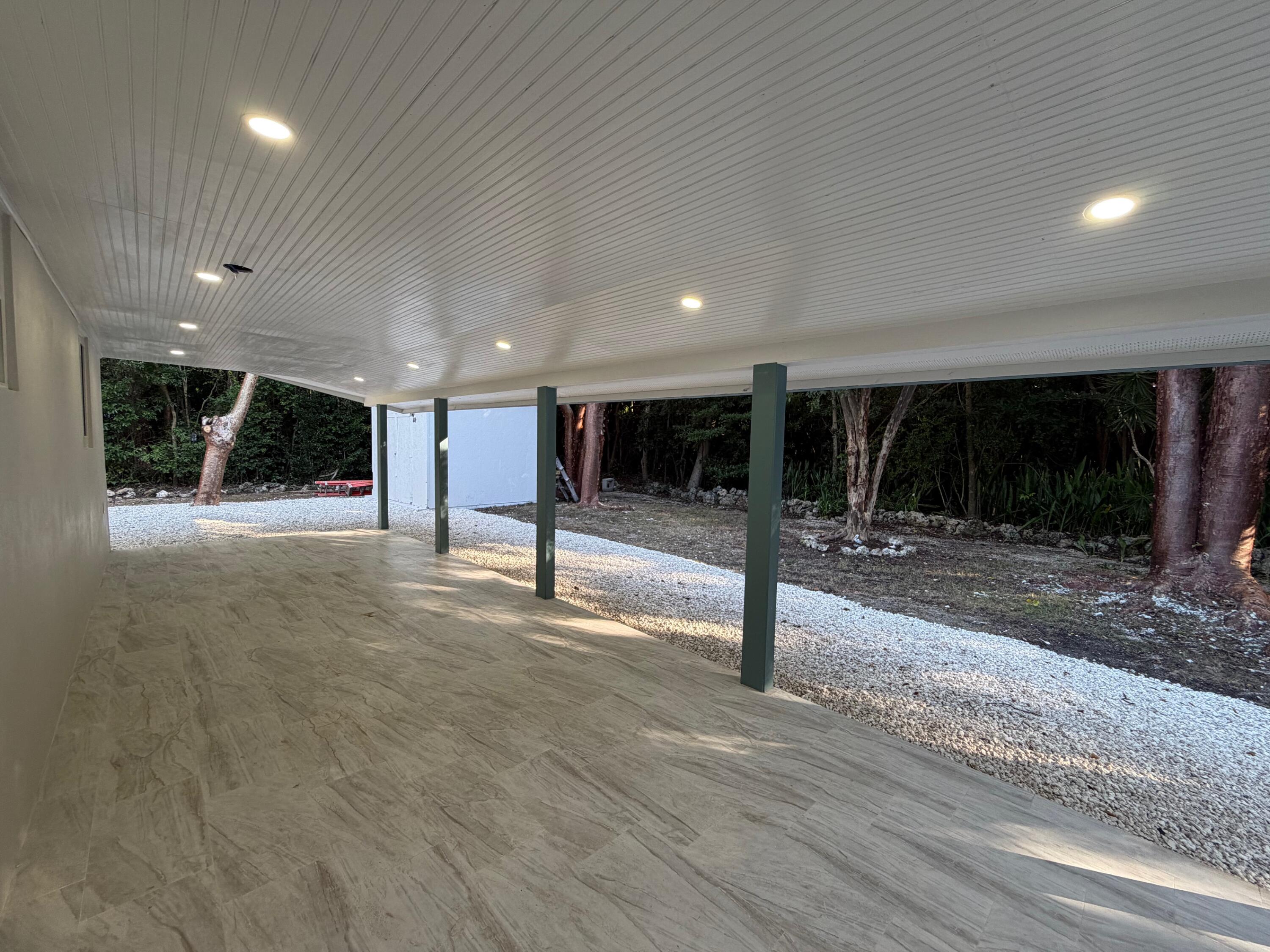 219 South Bay Harbor Drive, Unit A Key Largo, FL 33037 - Photo 17 of 18 a view of a hall with wooden floor