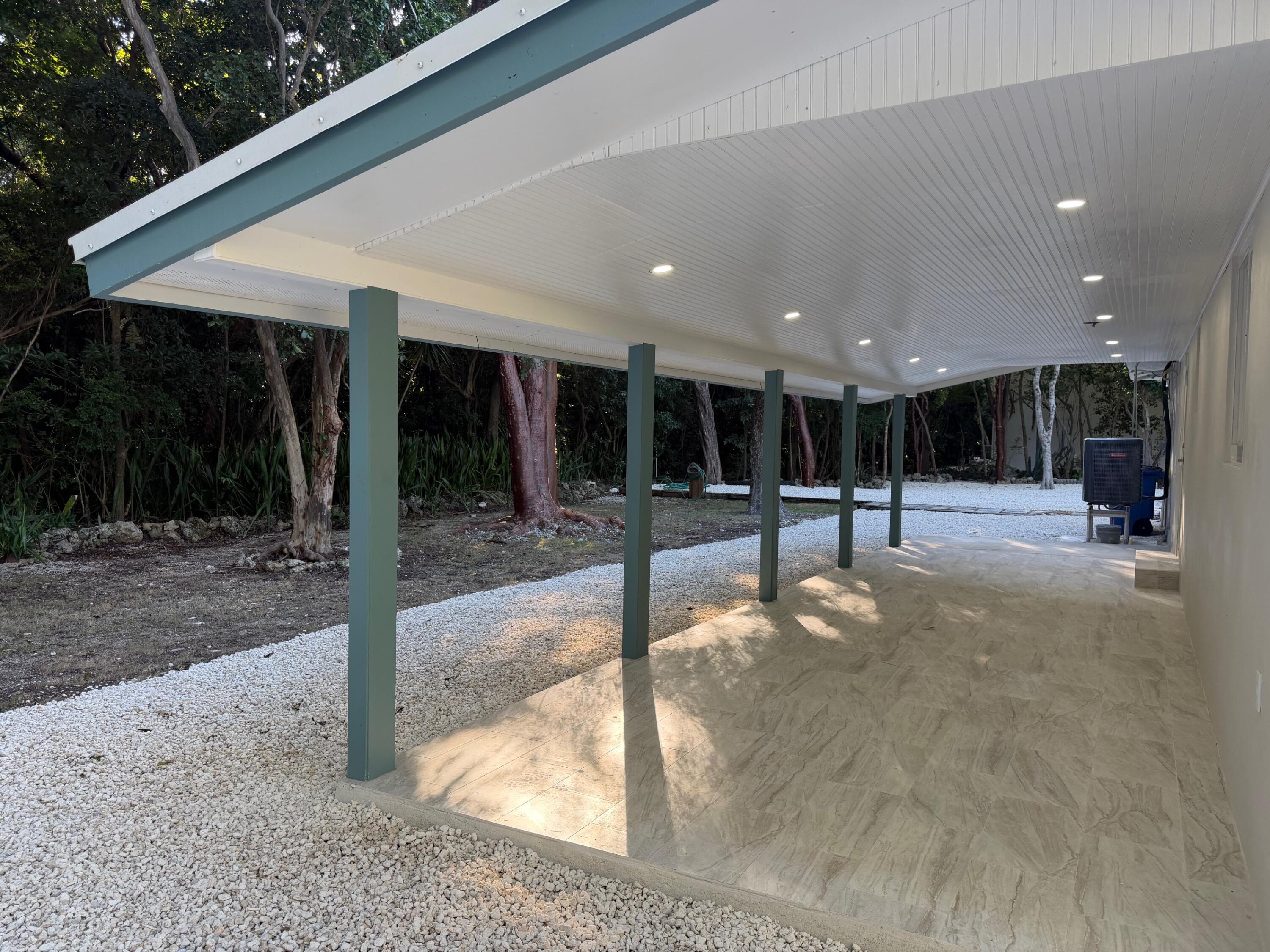 219 South Bay Harbor Drive, Unit A Key Largo, FL 33037 - Photo 18 of 18 a view of a hall with wooden floor