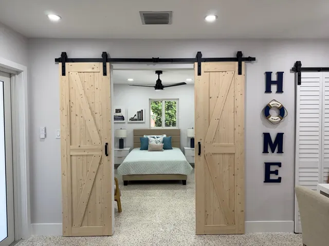 a bed room with a bed and a window