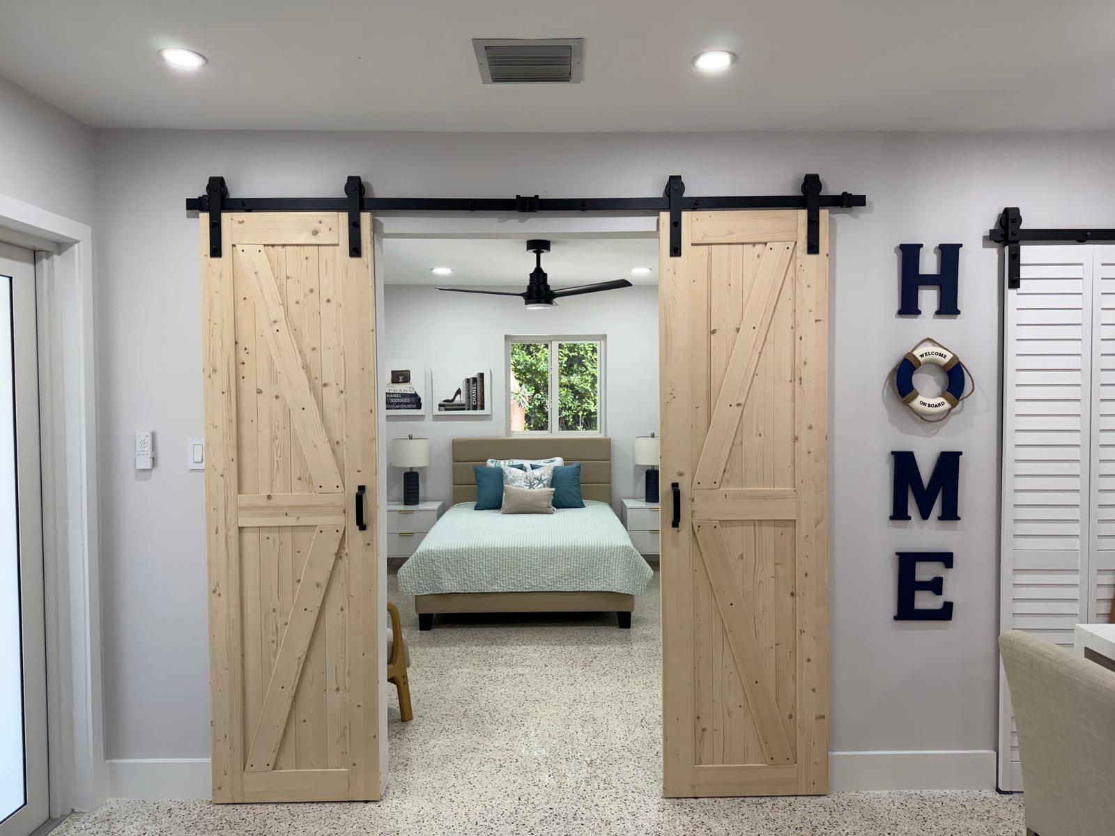 219 South Bay Harbor Drive, Unit A Key Largo, FL 33037 - Photo 7 of 18 a bed room with a bed and a window