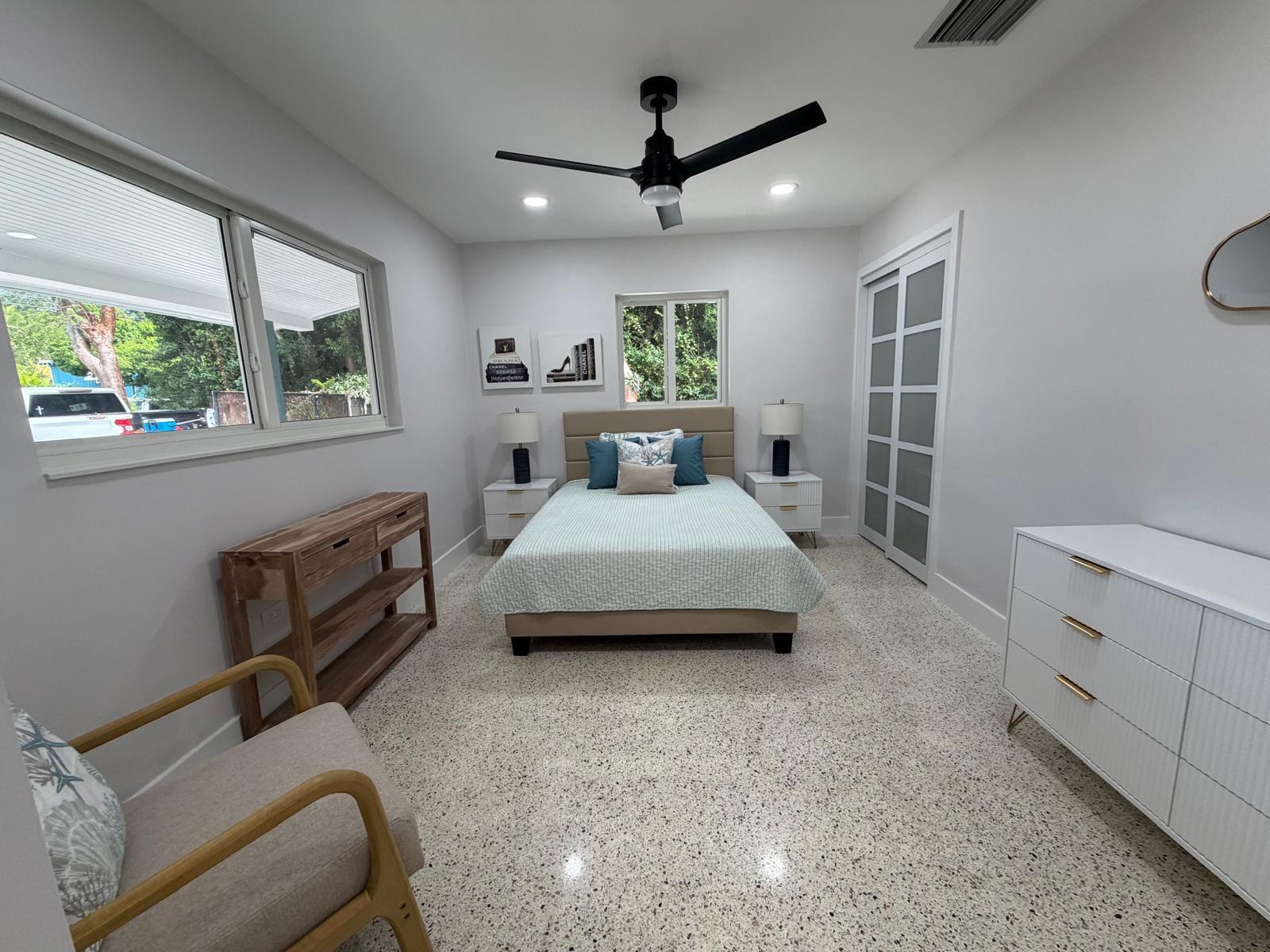 219 South Bay Harbor Drive, Unit A Key Largo, FL 33037 - Photo 8 of 18 a living room with furniture and a window