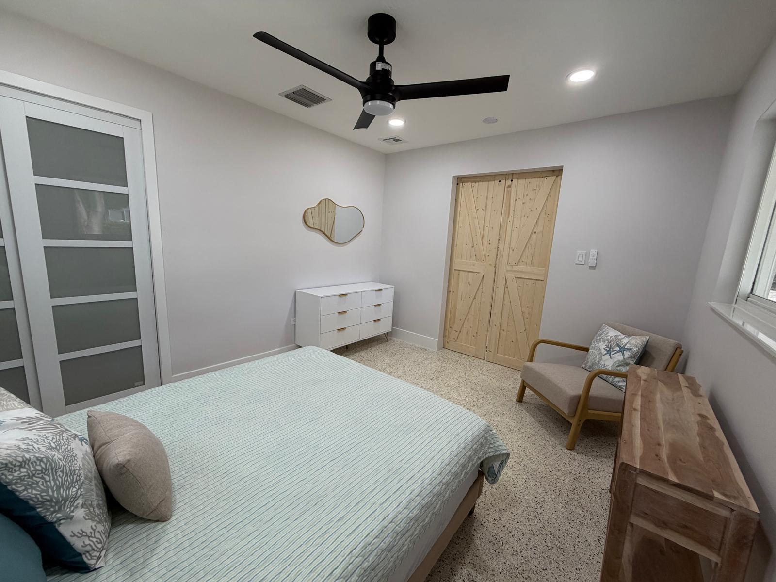 219 South Bay Harbor Drive, Unit A Key Largo, FL 33037 - Photo 10 of 18 a bedroom with a bed and a window