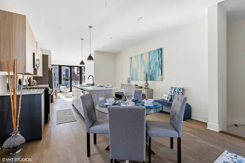 a dining room with furniture and window