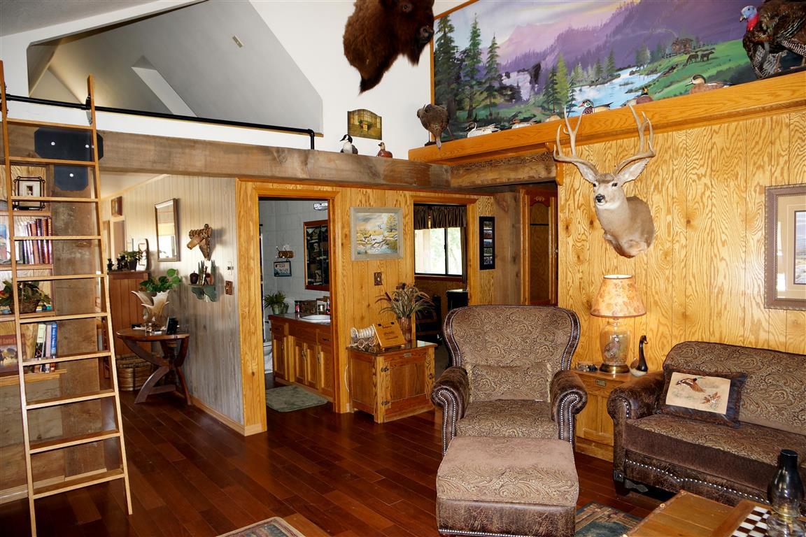 14388 Fern Road Whitmore, CA 96096 - Photo 40 of 52 an outdoor living area with furniture and wooden floor