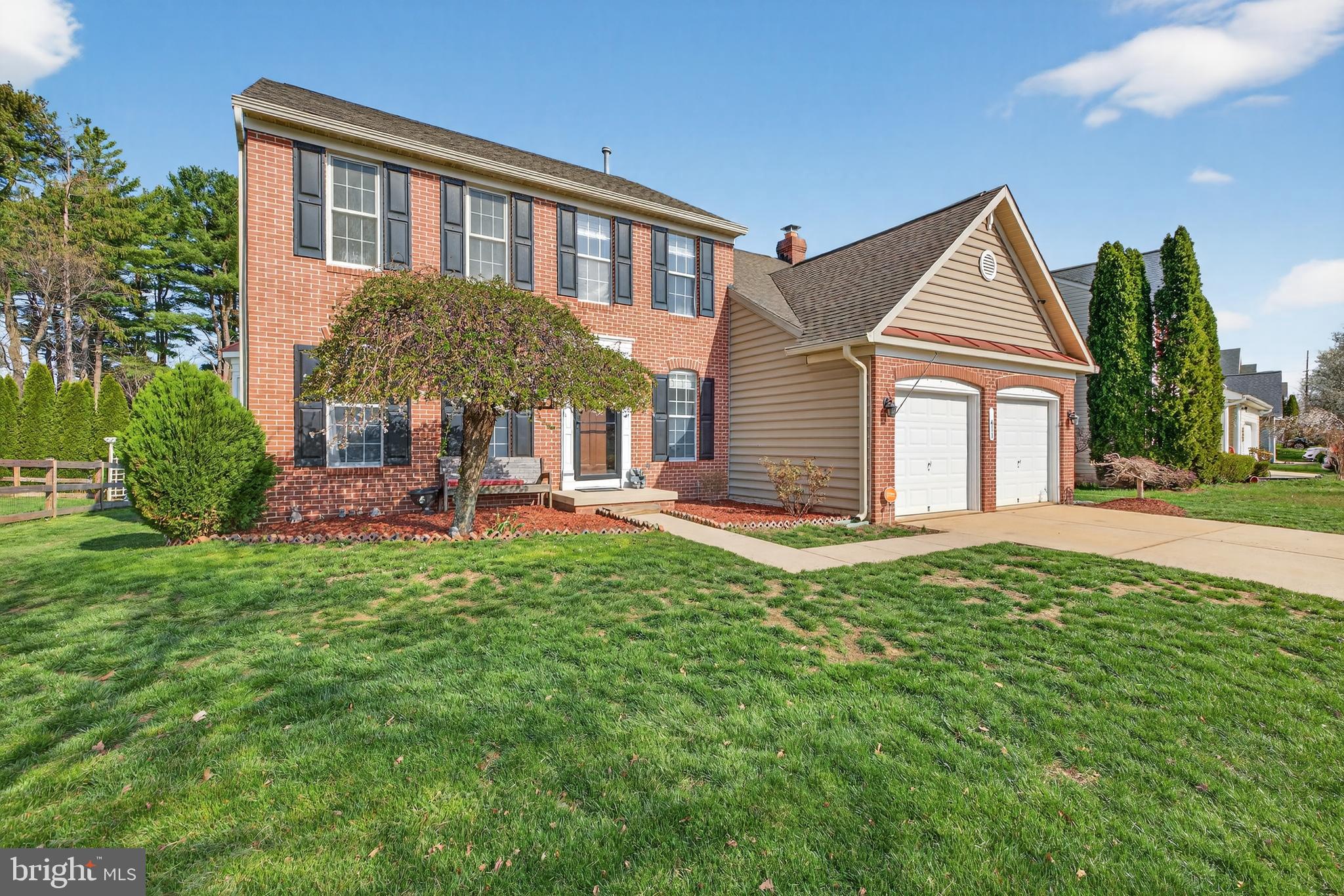 611 Hunting Ridge Drive Frederick, MD 21703 - Photo 2 of 50 a front view of a house with a yard