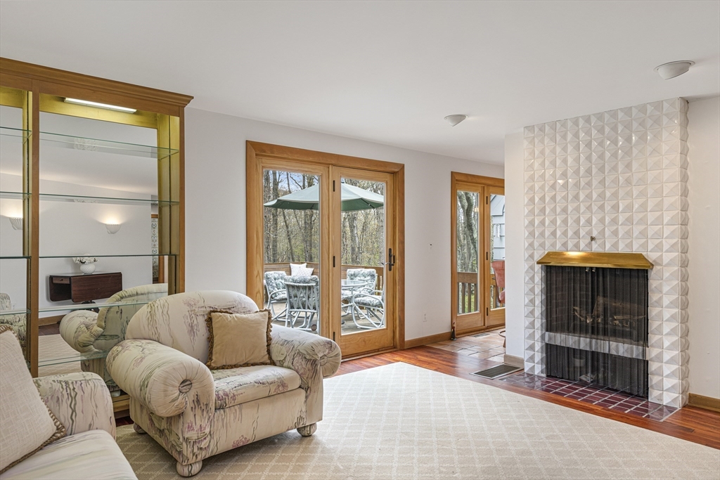 94 Howland Road Westport, MA 02790 - Photo 21 of 33 a living room with furniture and a fireplace