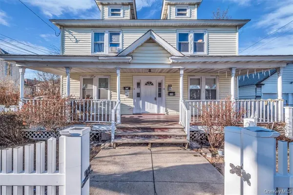 a front view of a house with a porch