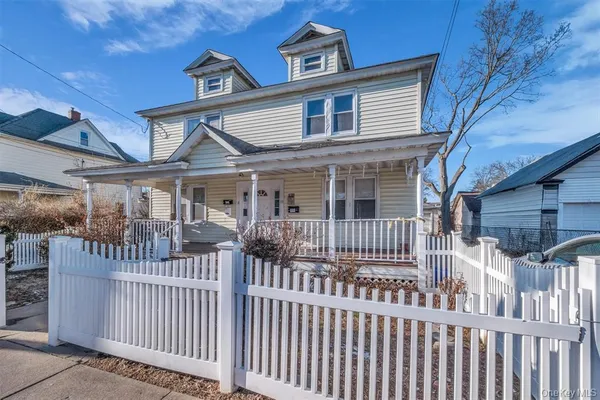 a front view of a house with a porch