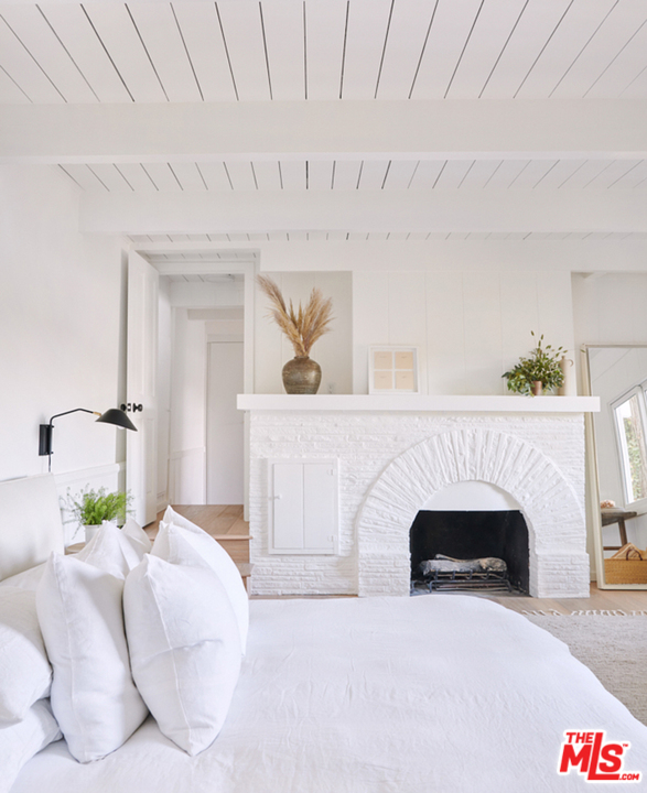 403 Emerald Way Lake Arrowhead, CA 92352 - Photo 12 of 30 a living room with furniture and a fireplace