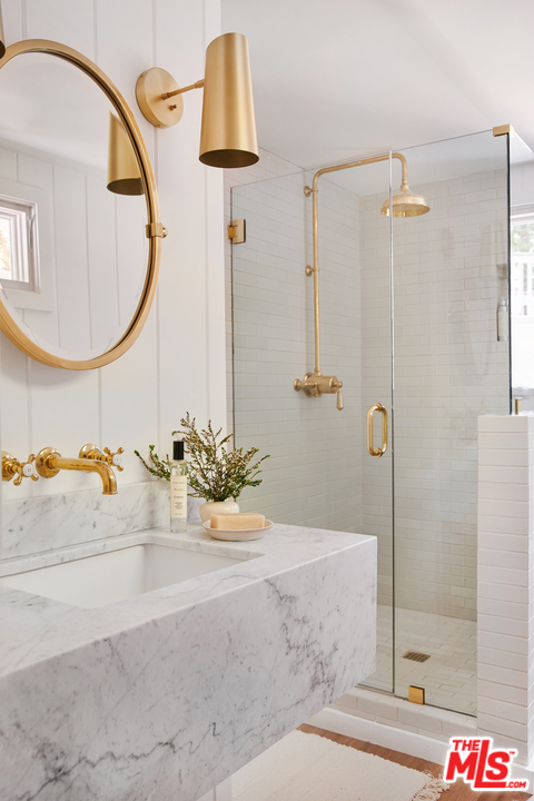 403 Emerald Way Lake Arrowhead, CA 92352 - Photo 17 of 30 a bathroom with a sink and a mirror