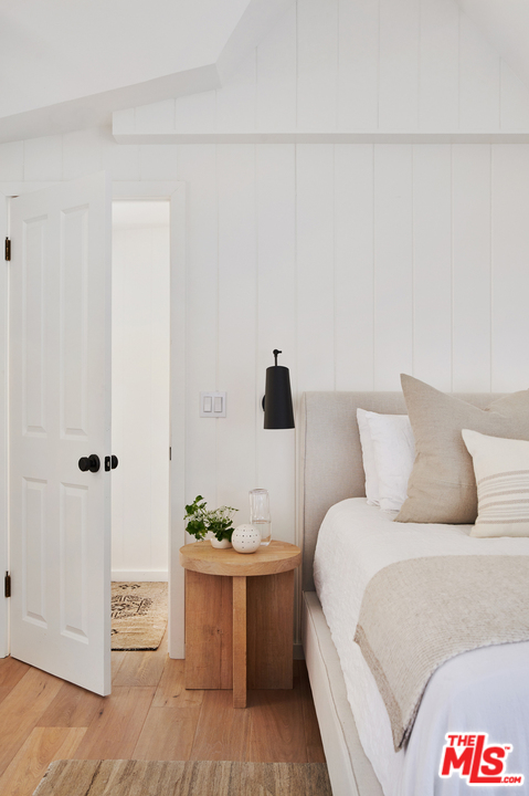 403 Emerald Way Lake Arrowhead, CA 92352 - Photo 18 of 30 a bed room with a bed and a night stand