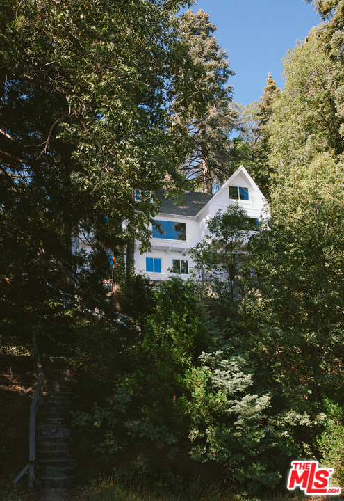 403 Emerald Way Lake Arrowhead, CA 92352 - Photo 28 of 30 a front view of a house with a yard and garage