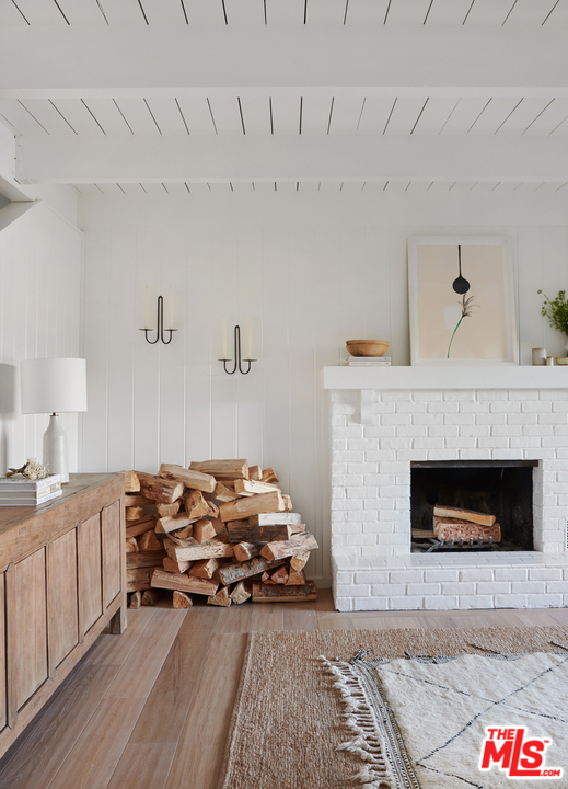 403 Emerald Way Lake Arrowhead, CA 92352 - Photo 4 of 30 a living room with furniture and a fireplace