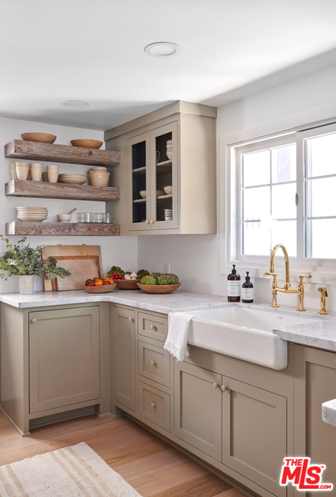 403 Emerald Way Lake Arrowhead, CA 92352 - Photo 9 of 30 a kitchen with stainless steel appliances a sink and cabinets