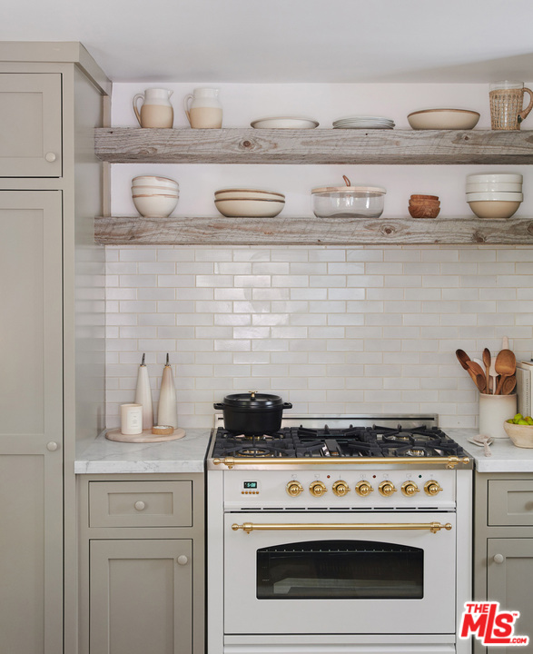 403 Emerald Way Lake Arrowhead, CA 92352 - Photo 10 of 30 a stove top oven sitting inside of a kitchen