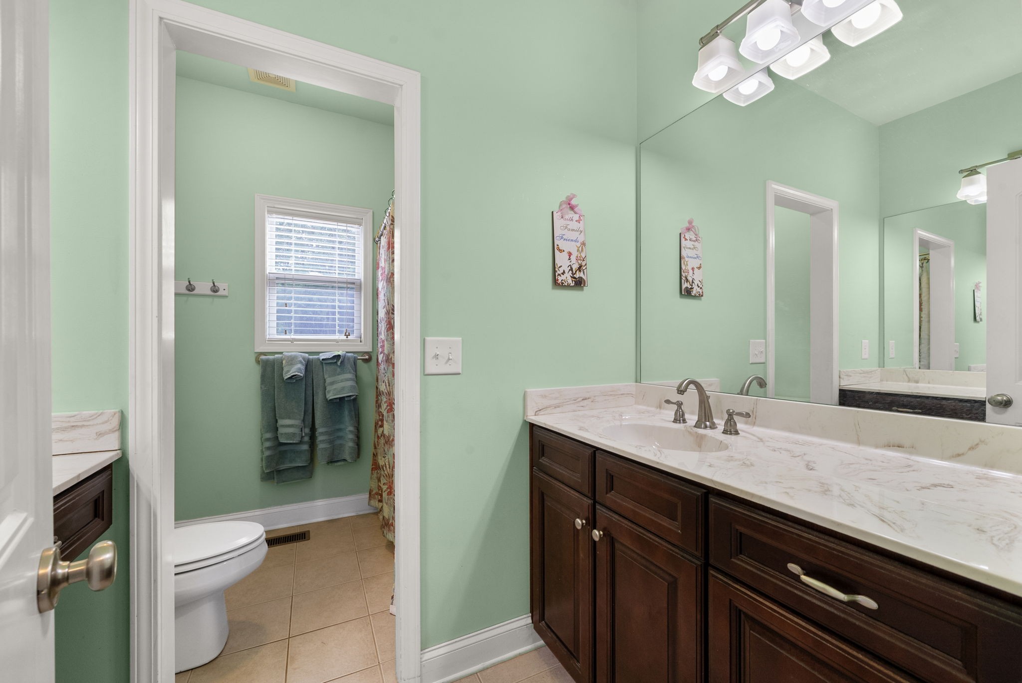 4940 Marion Road Cunningham, TN 37052 - Photo 14 of 43 a bathroom with a sink a toilet and shower
