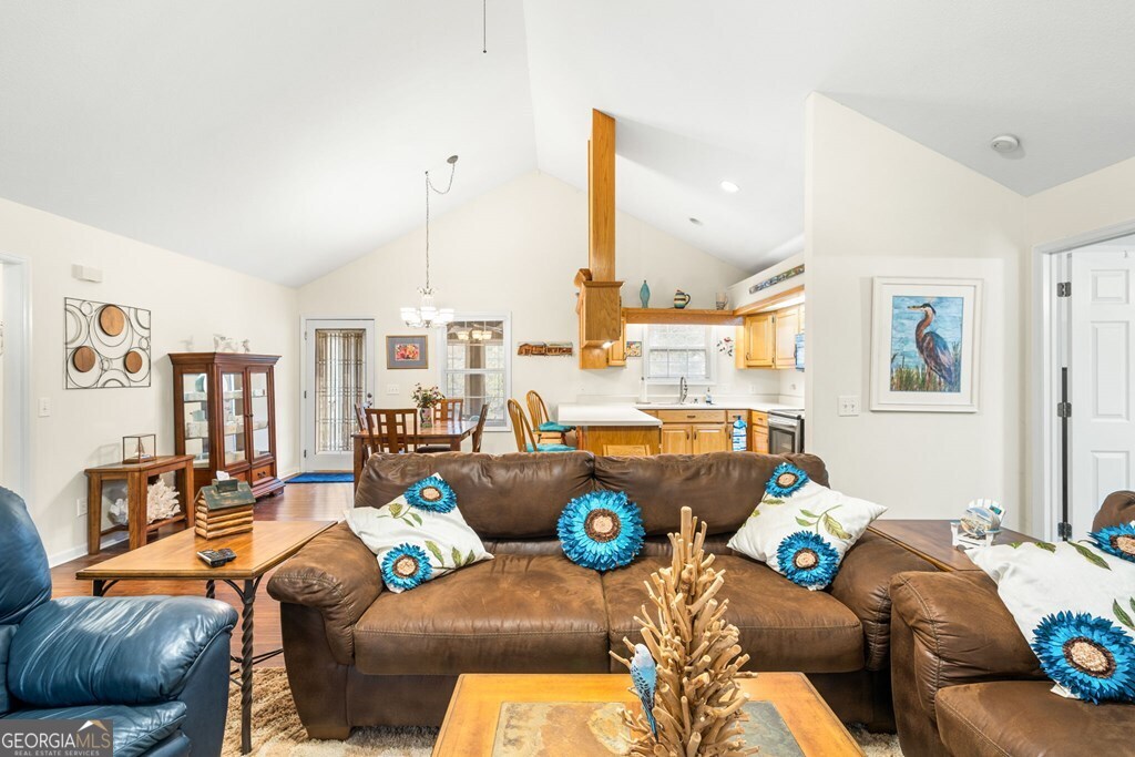 251 Rivers Edge Drive Hayesville, NC 28904 - Photo 13 of 45 a living room with furniture and a large window