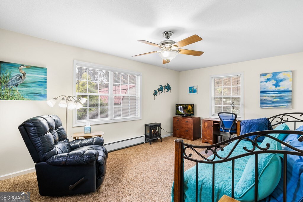 251 Rivers Edge Drive Hayesville, NC 28904 - Photo 20 of 45 a living room with furniture and a window