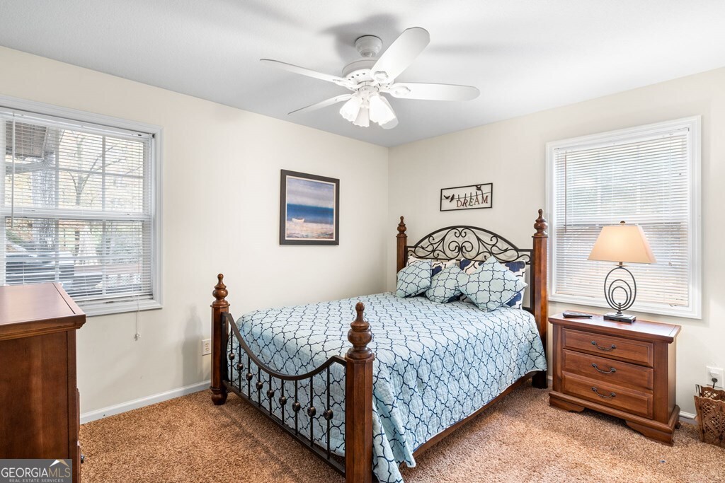 251 Rivers Edge Drive Hayesville, NC 28904 - Photo 21 of 45 a bedroom with a bed and a table