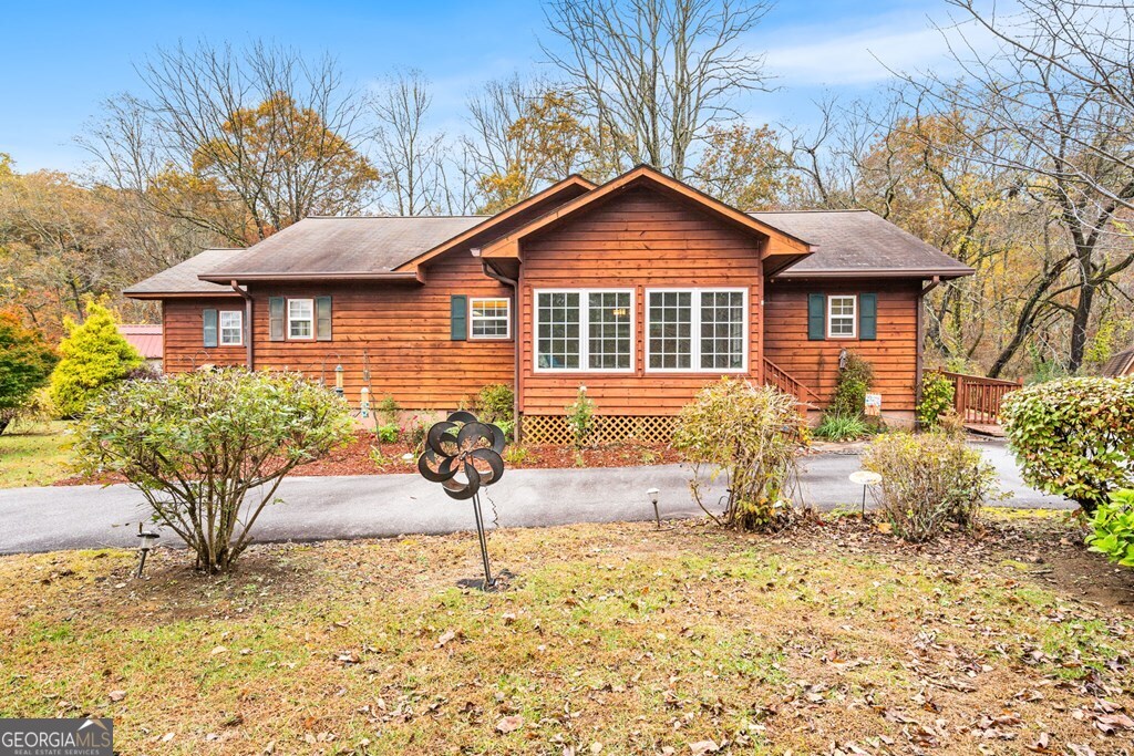 251 Rivers Edge Drive Hayesville, NC 28904 - Photo 35 of 45 a front view of a house with garden