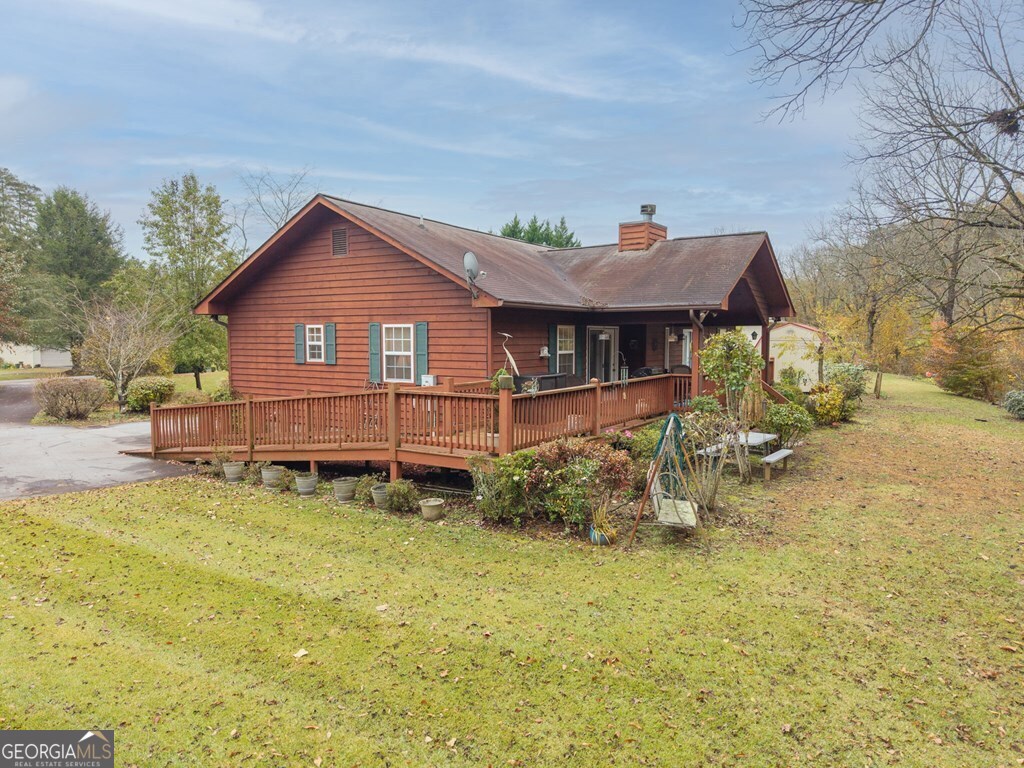 251 Rivers Edge Drive Hayesville, NC 28904 - Photo 41 of 45 a view of a house with a yard patio and sitting area