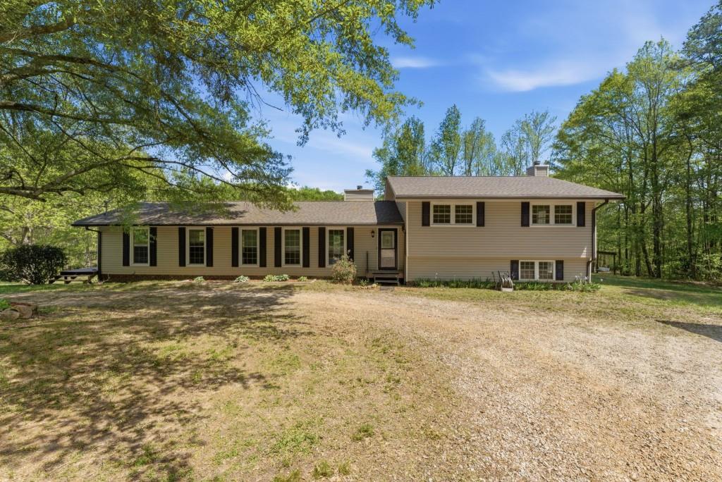 224 Old Franklin Street Roopville, GA 30170 - Photo 1 of 60 front view of a house with a yard