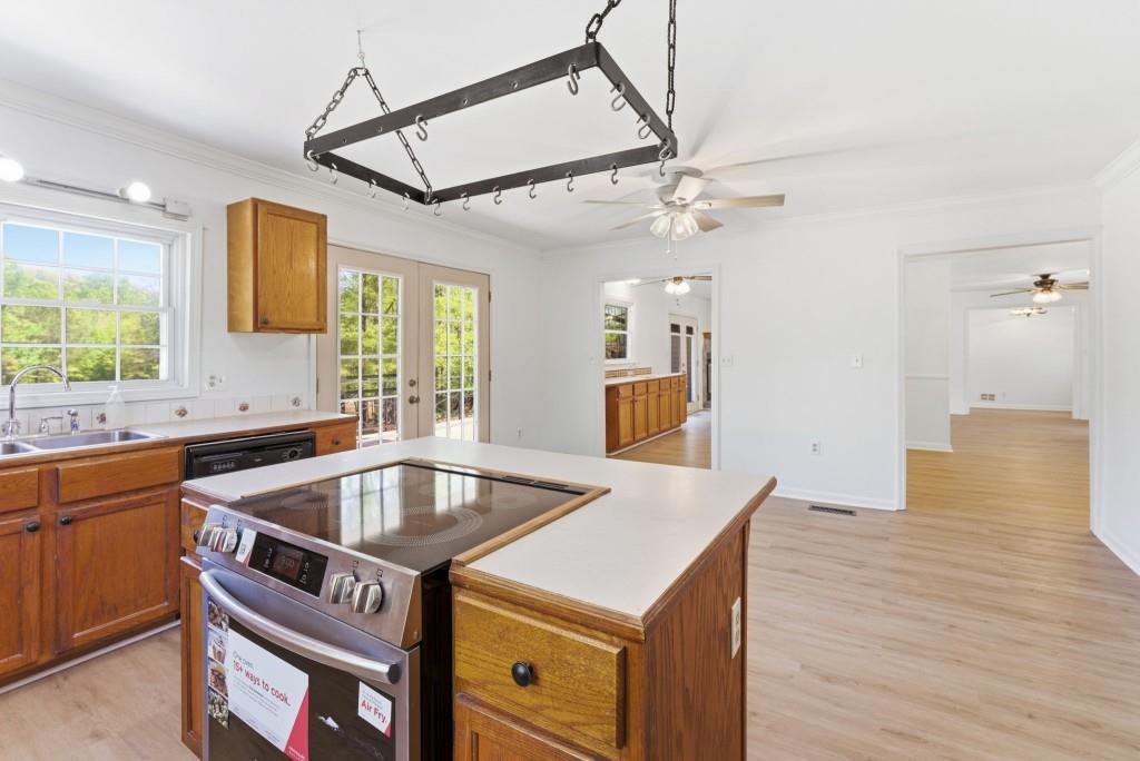 224 Old Franklin Street Roopville, GA 30170 - Photo 12 of 60 a kitchen that has a sink and a table in it